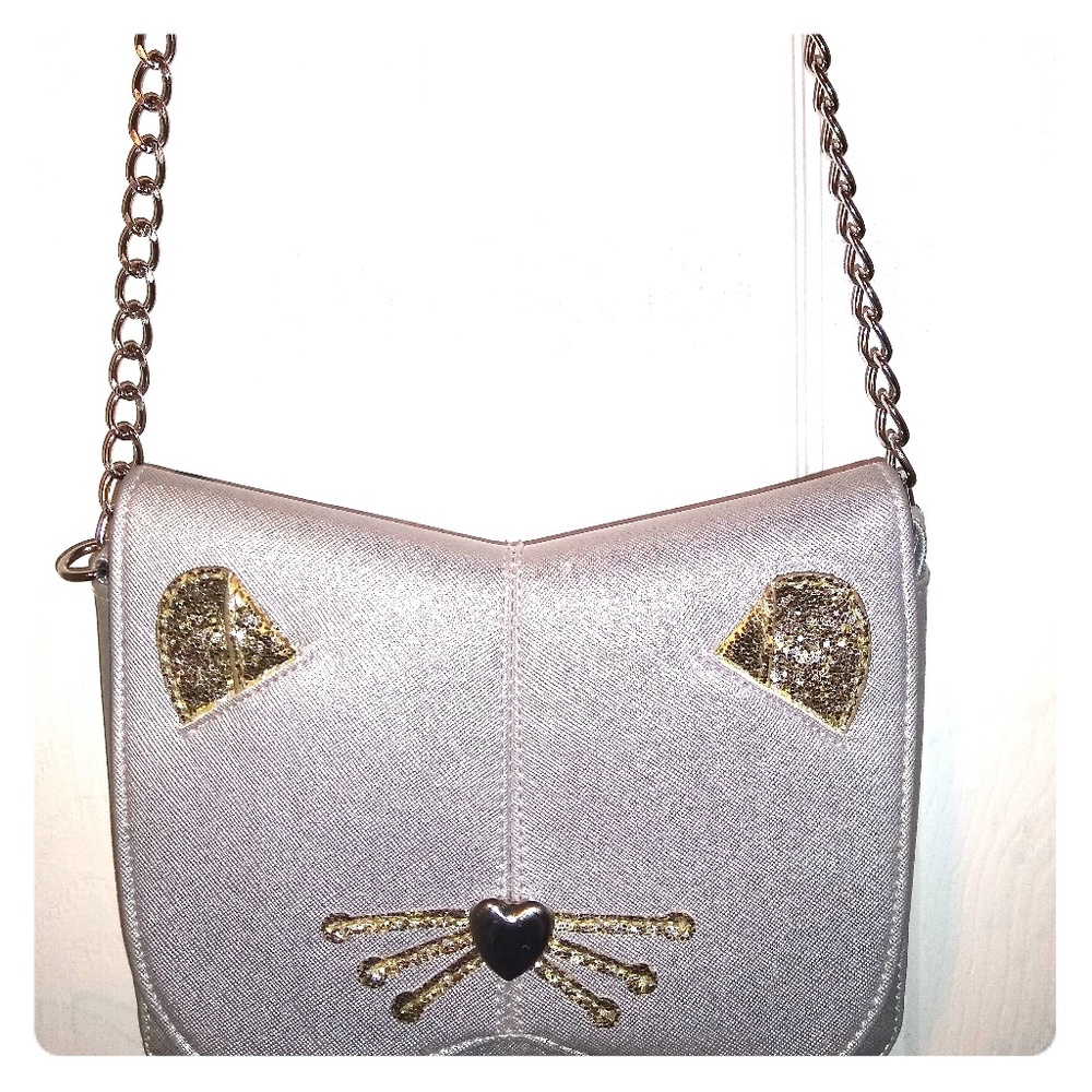 Adorable silver crossbody with gold kitty cat face